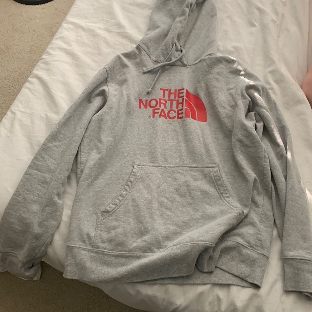 Gray North Face Hoodie with graphics on the back